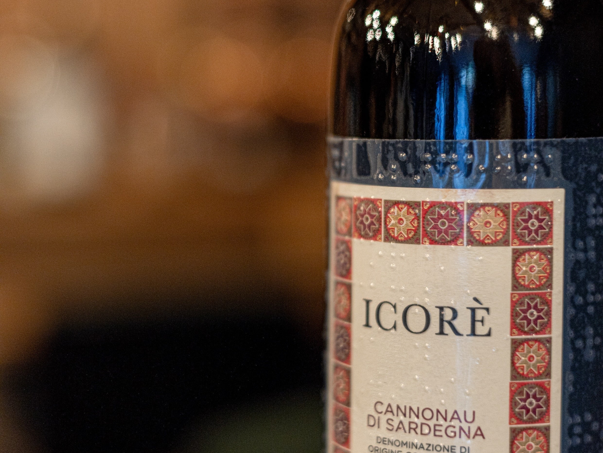 Bottle of Sardinian Icore wine with braille label